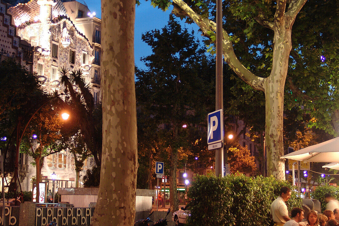 People in a restaurant and Casa Batllo in the evening, Passeig de Gracia, Barcelona, Spain, Europe