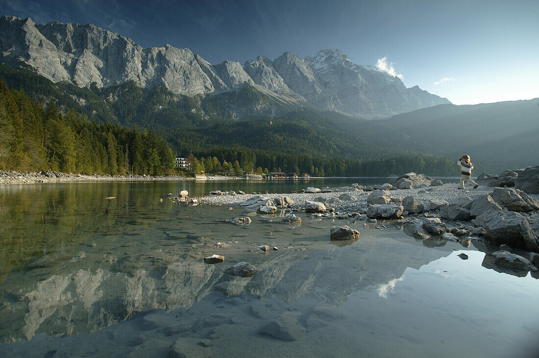 Playing child at Eibsee, Zugspitze, Bavaria, Germany