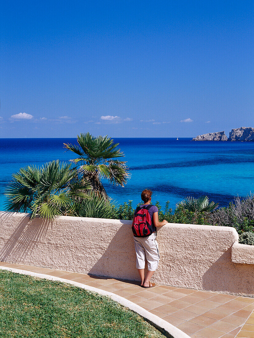 Female hiker admiring the view, Cala Mesquida, Majorca, Spain