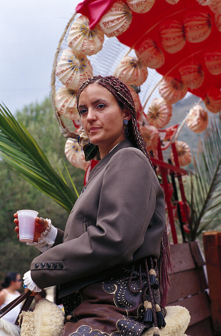 Woman on horseback in front of decorated cart, Romeria de San Isidro, Nerja, Costa del Sol, Malaga province, Andalusia, Spain, Europe