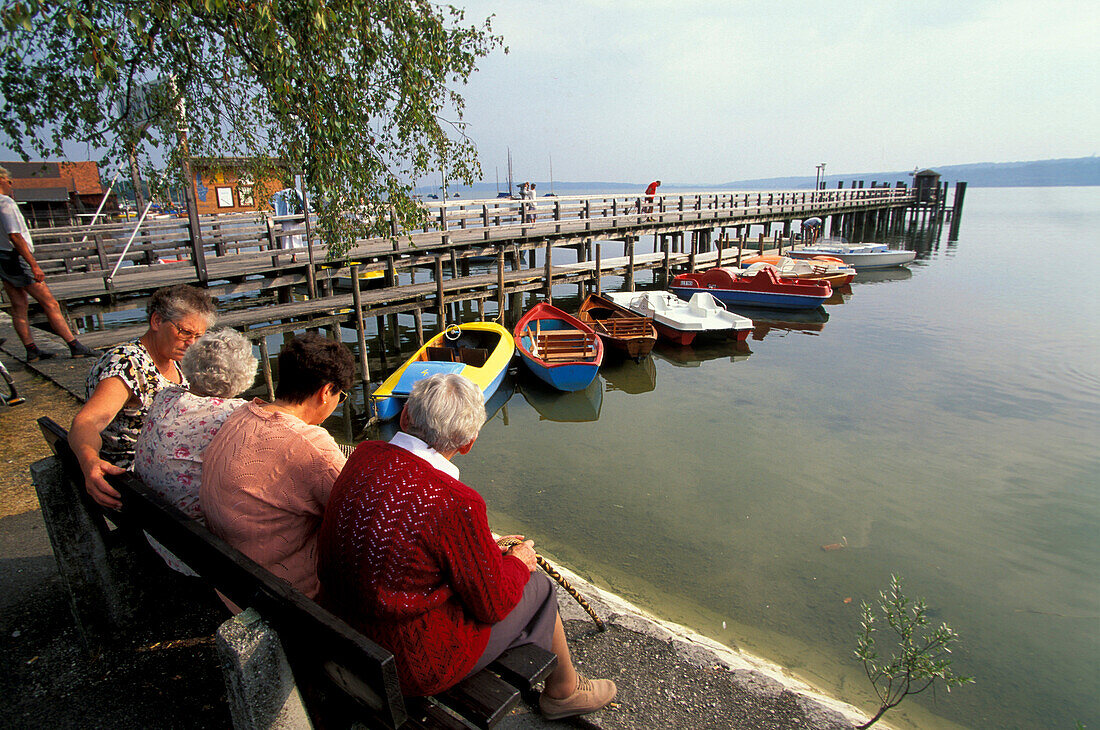 Women, sitting on bench, Diessen, Ammersee Bavaria, Germany