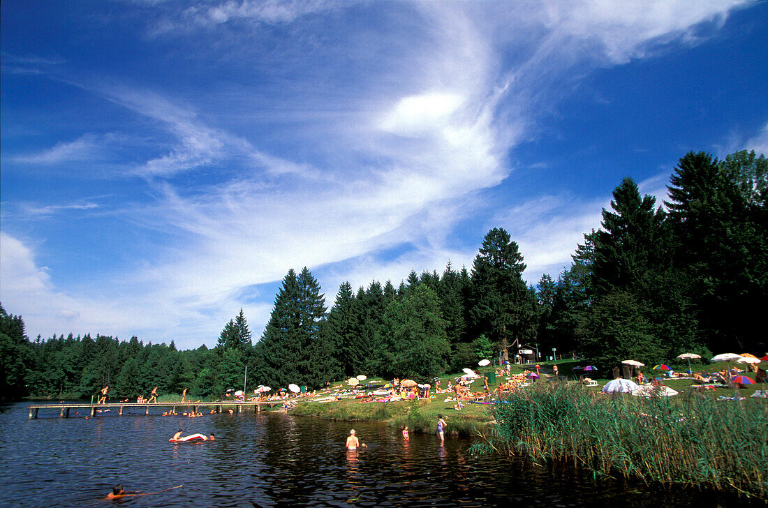 People bathing in Eizenberg Pond, Fuenfseenland, Bavaria, Germany
