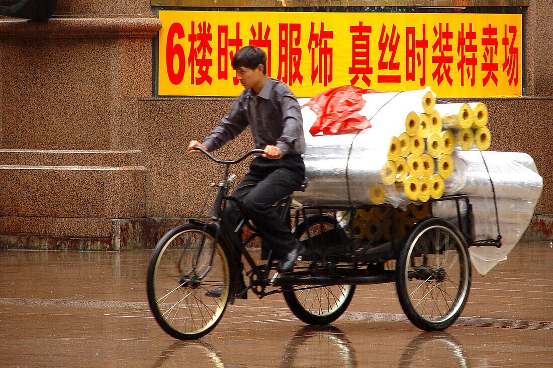 Cycling in the rain, Shanghai China