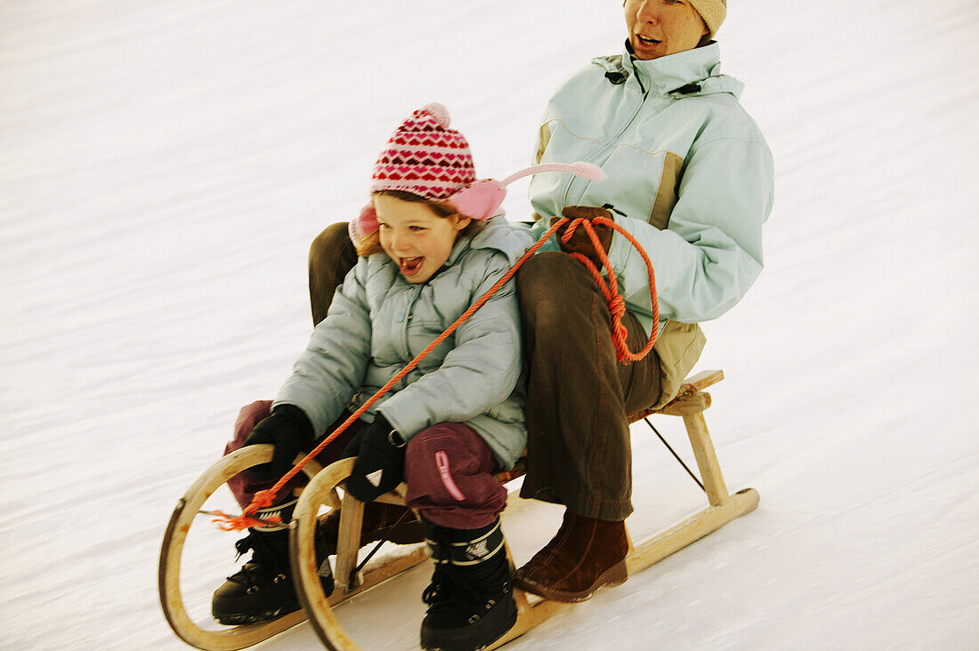 Mother and daughter sledding, Kuhtai, Tyrol, Austria