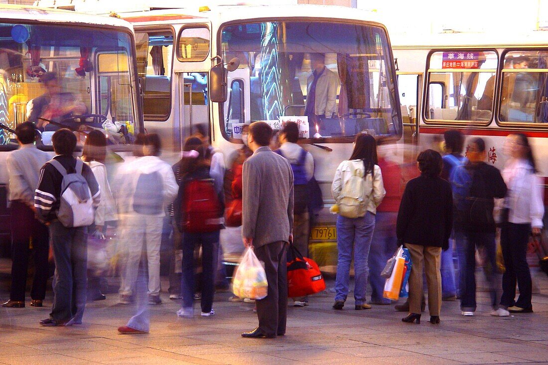 People at the bus station in the evening, Shanghai, China, Asia