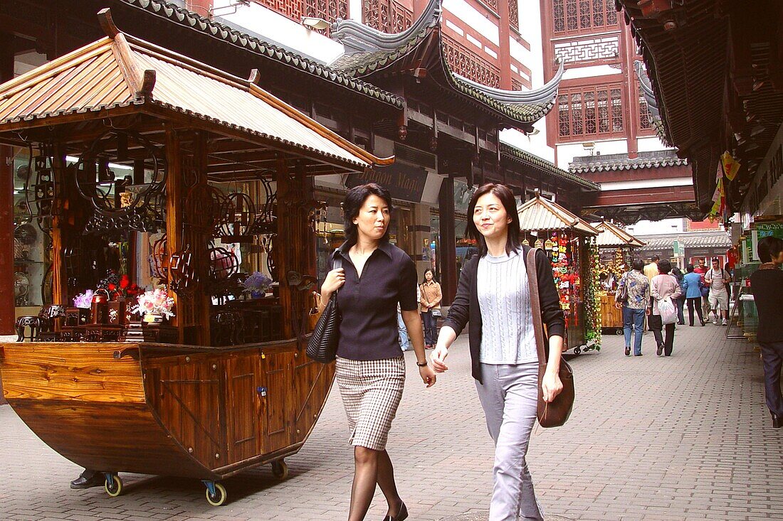 Chinese women in front of traditional houses, Shanghai, China, Asia
