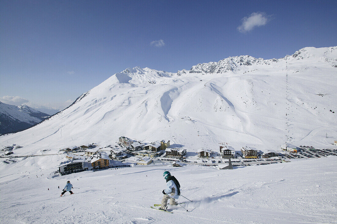 Children skiing downhill on slope, Kuhtai, Tyrol, Austria