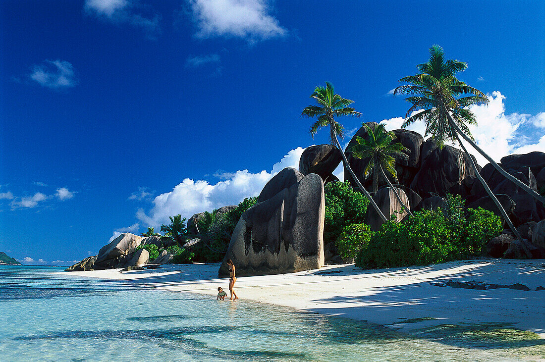 Mother and daughter on the beach, Anse Source d´Argent, La Digue, Seychelles, Indian Ocean