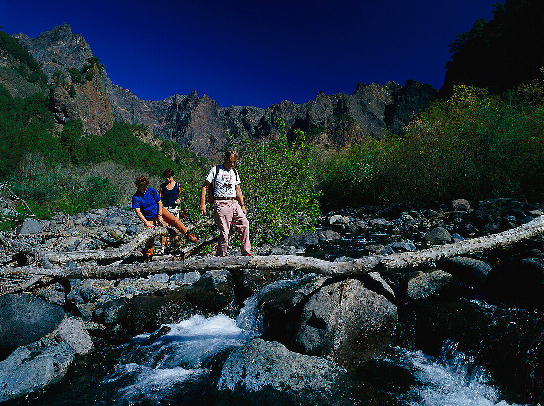 Three hikers, Caldera de Taburiente NP, La Palma, Canary Islands, Spain