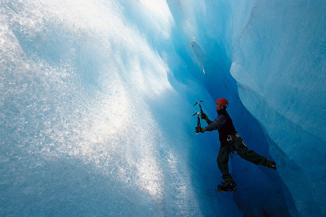 Ice climber on steep climb, Briksdal Glacier, Norway