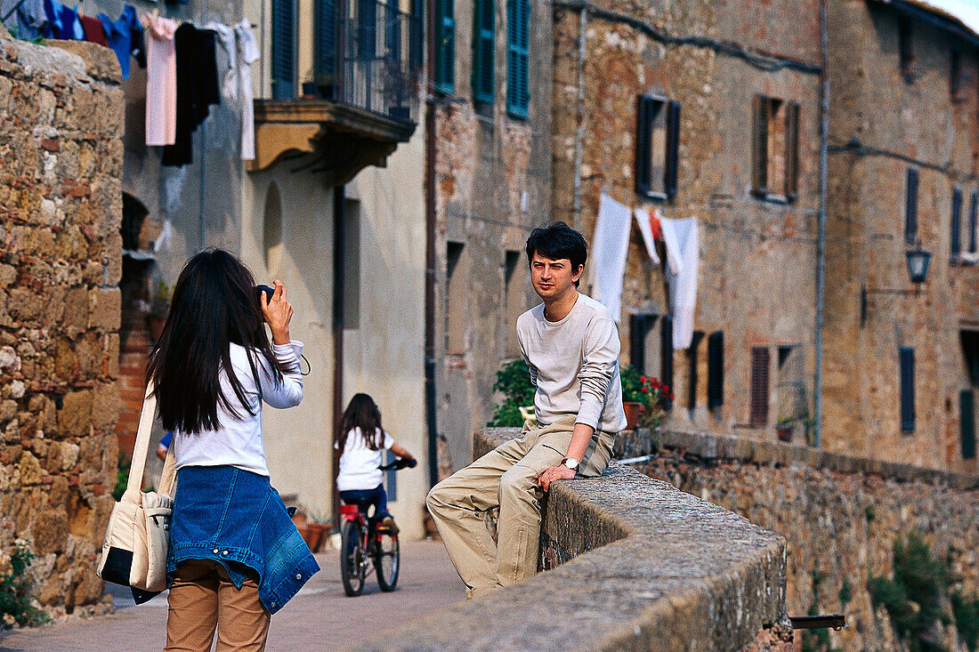 Tourists taking photo, Pienza, Tuscany, Italy