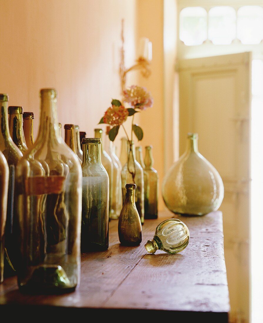 Empty wine bottles on a wooden tables