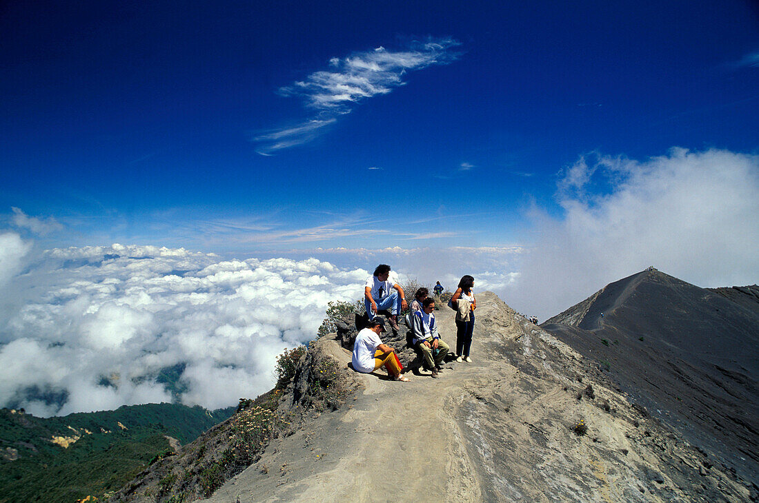 People at the border of the basic crater of volcano Irazú, Costa Rica, Central America, America