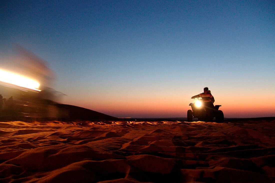 All-terrain vehicle in the desert, Dubai, UAE