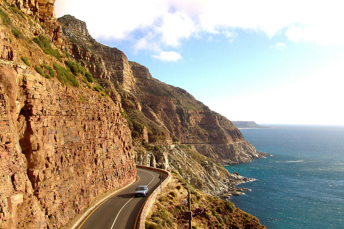 Coast road under clouded sky, Chapman's Peak Drive, Cape Town, South Africa, Africa
