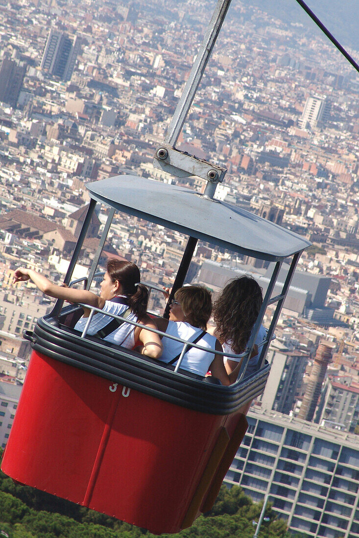 People in a cable car on the Montjuic mountain, Barcelona, Spain, Europe