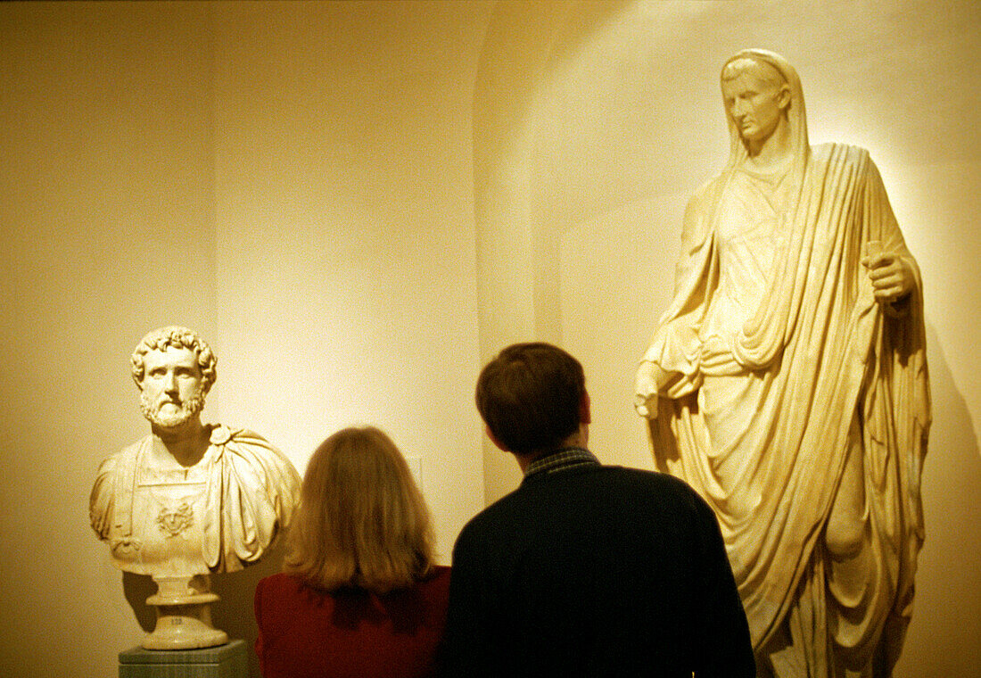 People looking at sculptures at the Prado, Madrid, Spain, Europe