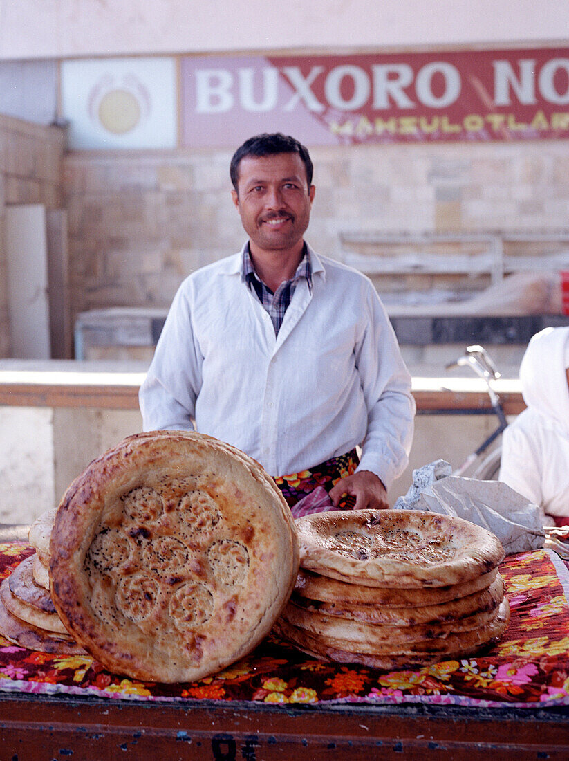 Baker sells bread, Lavash, Market, Silk Road, Uzbekistan