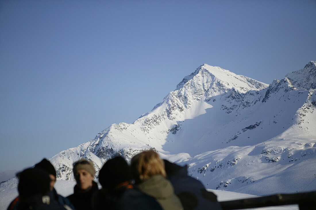 Skiers at ski hut Kaiser Maximilian, mountain Gaisskogel in background, Kuhtai, Tyrol, Austria