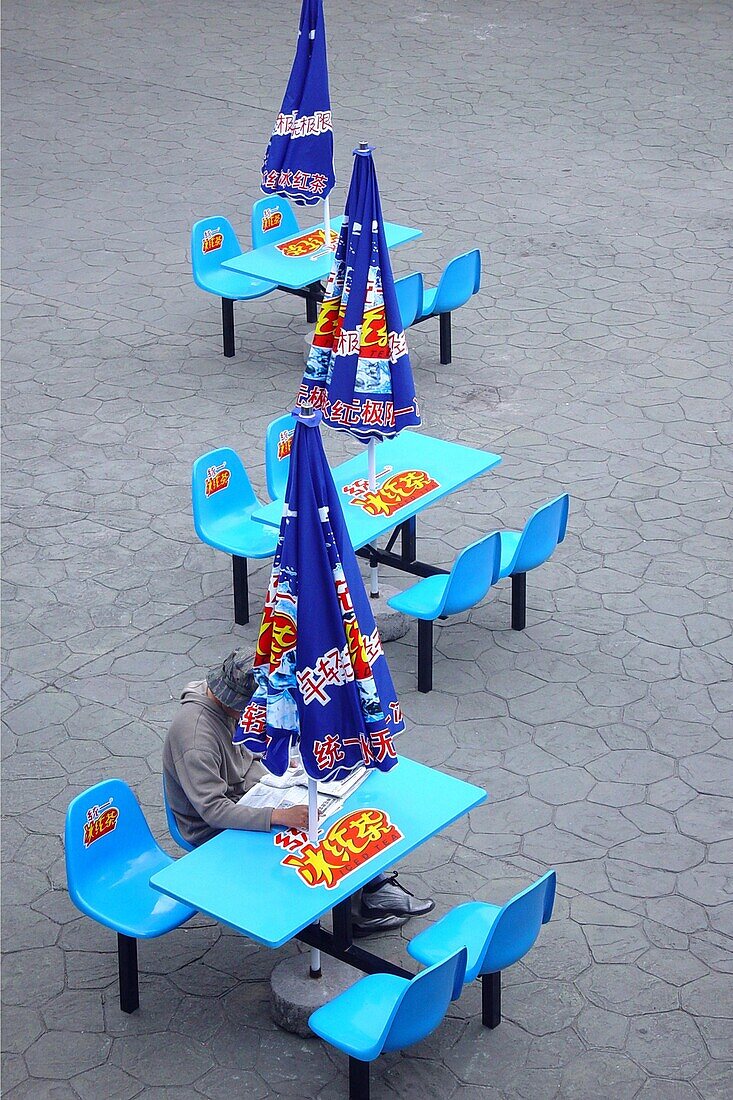 Person at the table of a fast food restaurant, Shanghai, China, Asia