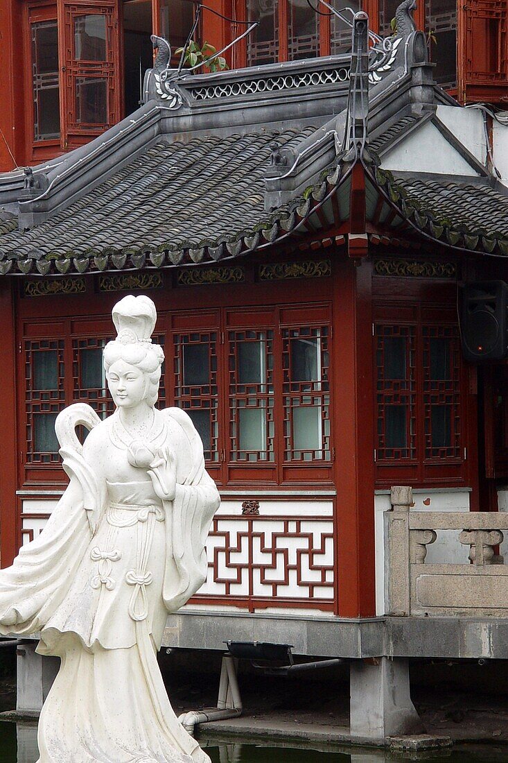 Statue in front of a traditional house, Shanghai, China, Asia