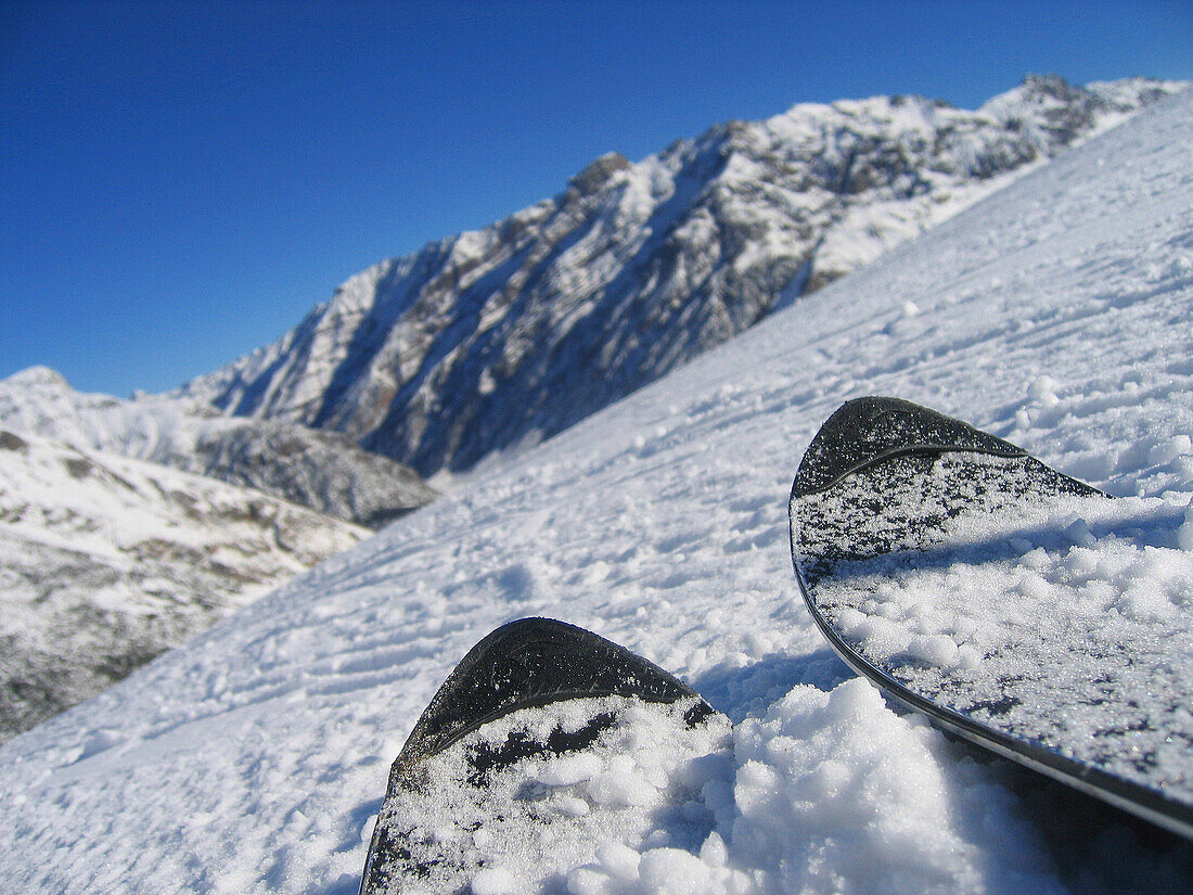 Close up of skis on a slope, Livigno, Italy