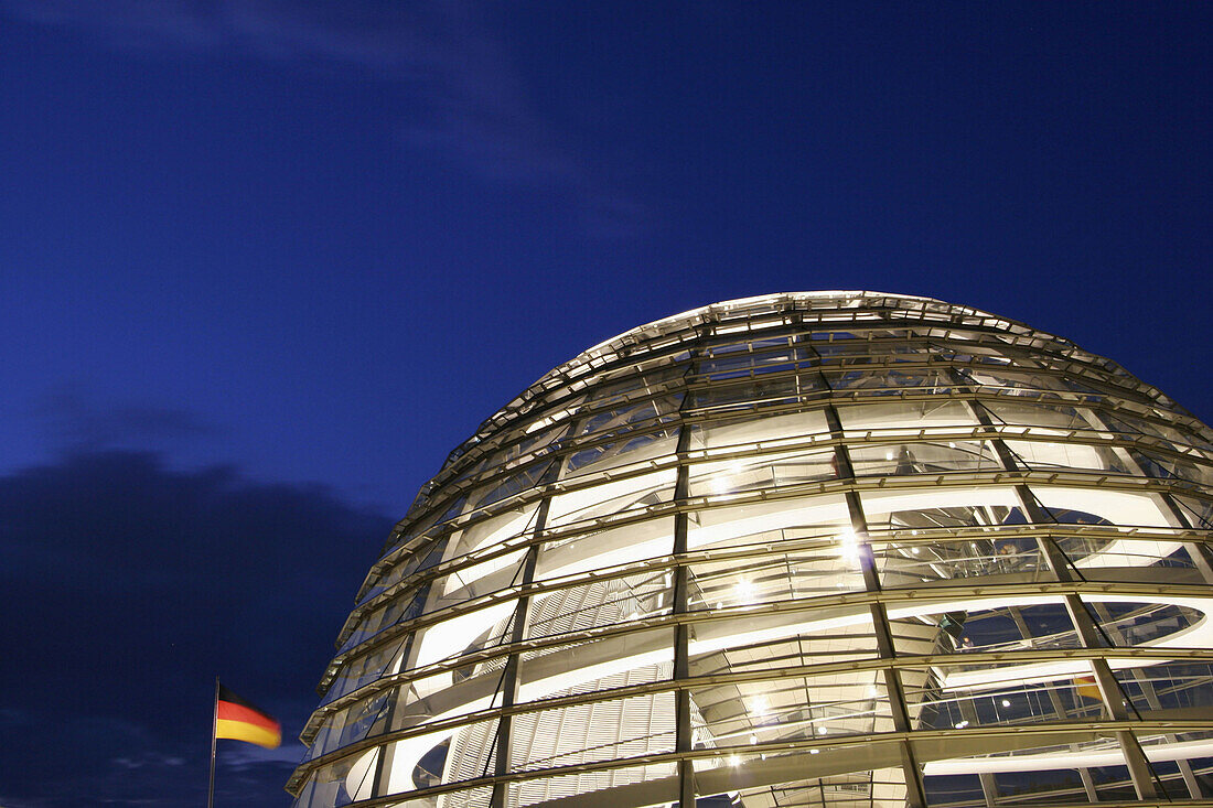 Reichstag dome and German flag at night, Berlin, Germany