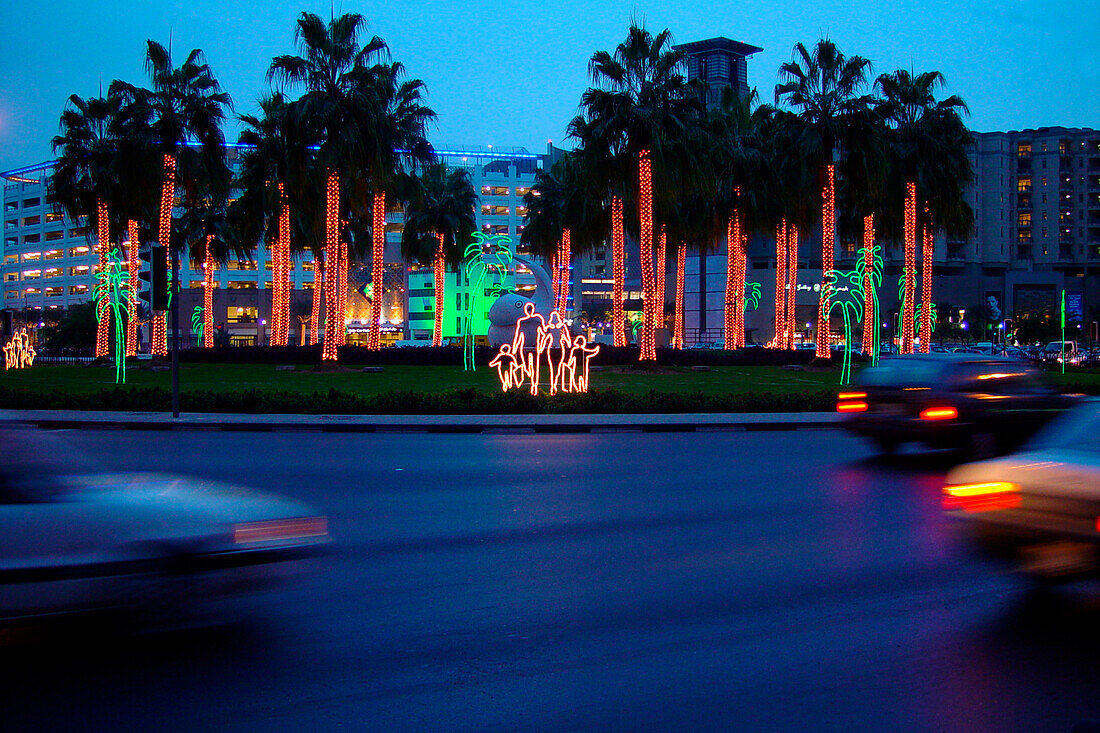 Illuminated palm trees at a roundabout in the evening, Dubai, UAE, United Arab Emirates, Middle East, Asia