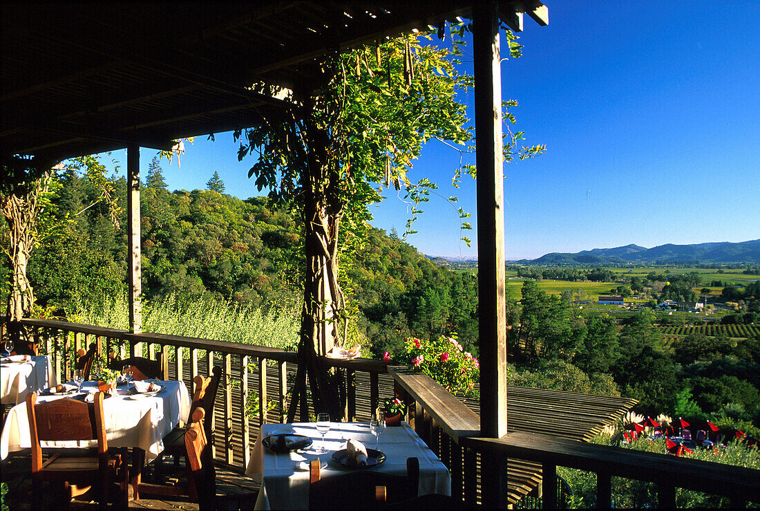 Tables at veranda of Auberge du Soleil hotel and restaurant, Napa Valley, California, USA, America