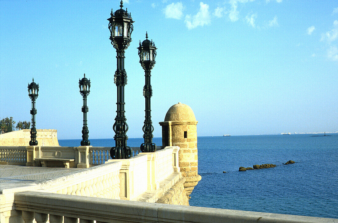 Seaside promenade with street lanterns at Cadiz, Andalusia, Spain, Europe