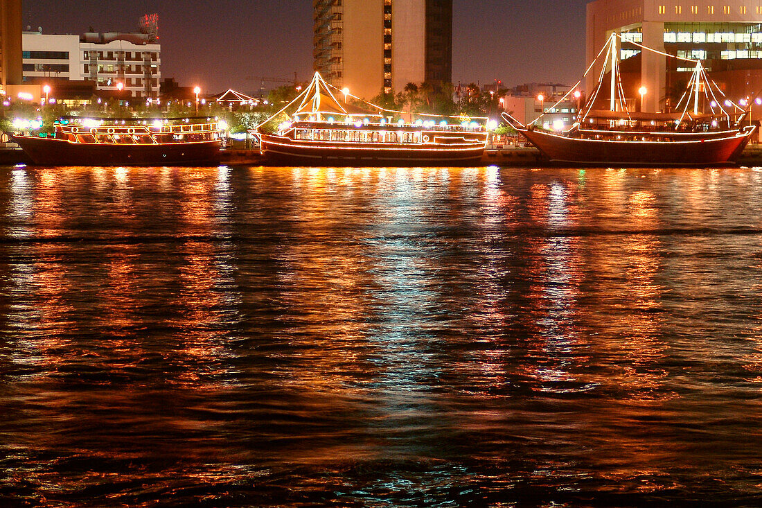 Illuminated buildings at Dubai Creek at night, Dubai, UAE, United Arab Emirates, Middle East, Asia