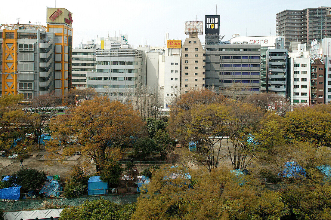 blue boxes of homeless on a car park roof in Shibuya, Japan