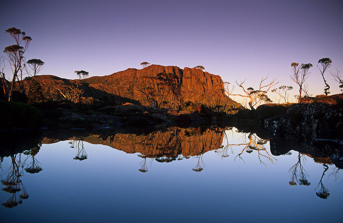 Early morning mirrored reflection of Mount Geryon in Lake Elysia, Overland Track, Cradle Mountain-Lake St Clair National Park, Tasmania, Australia