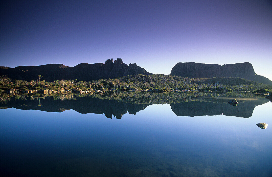Early morning mirrored reflection of Mount Geryon in Lake Elysia, Overland Track, Cradle Mountain-Lake St Clair National Park, Tasmania, Australia
