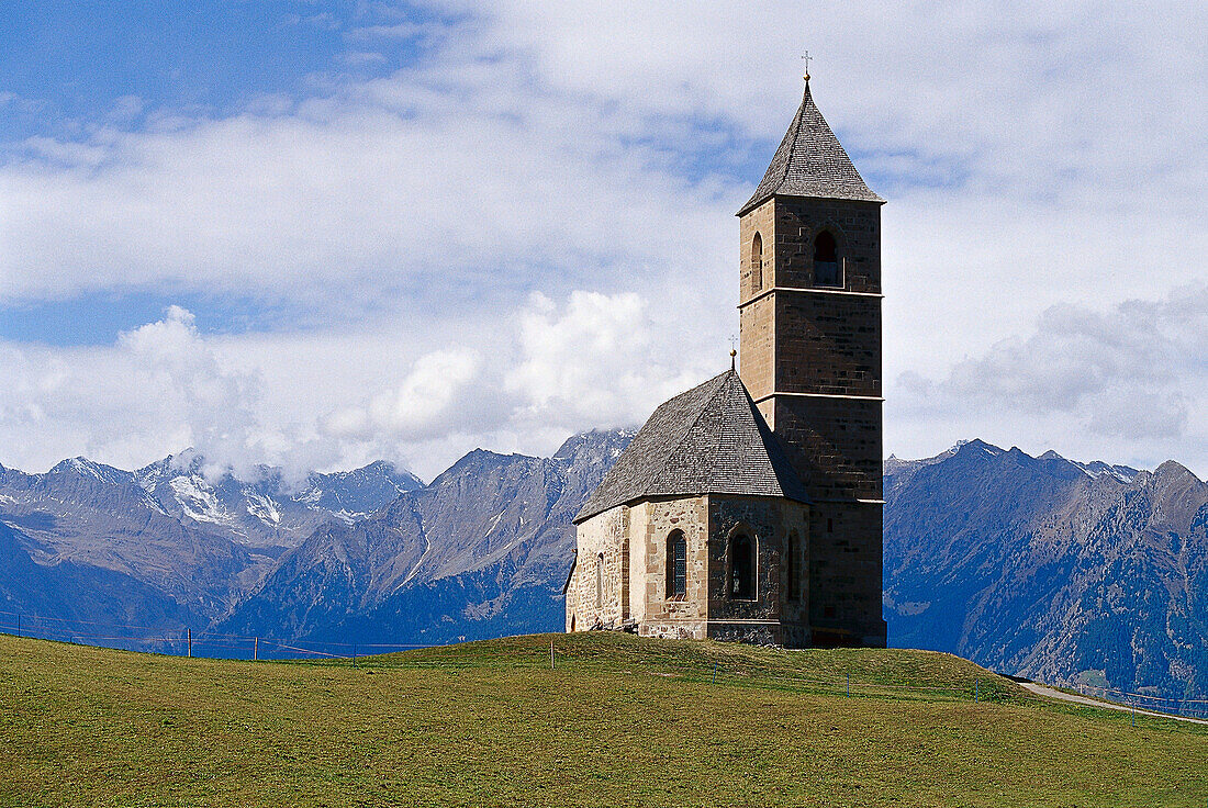 Church in the mountains under clouded sky, Hafling, South Tyrol, Italy, Europe