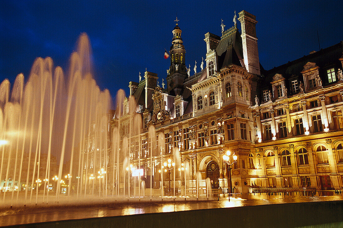 Hotel de Ville, illuminated town hall and fountain in the evening, Paris, France, Europe
