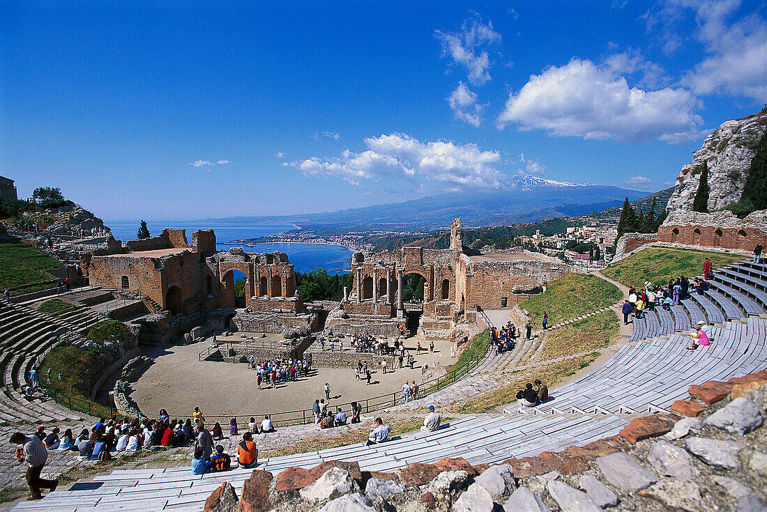 Tourists at Theatro Greco under blue sky, Taormina, Sicily, Italy, Europe