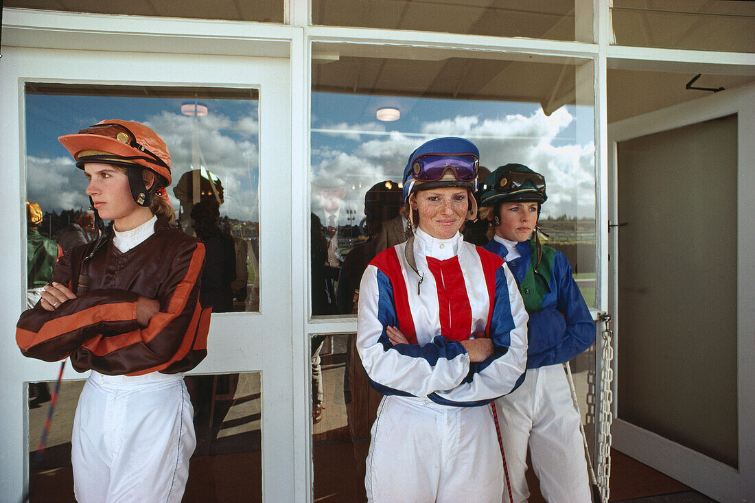 Three young female jockeys in the uniform, Auckland races, Auckland, North Island, New Zealand