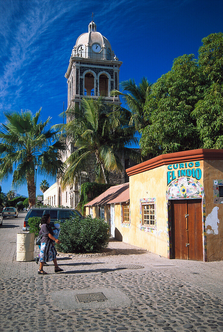 Church behind palm trees in the sunlight, Loreto, Baja California Sur, Mexico, America