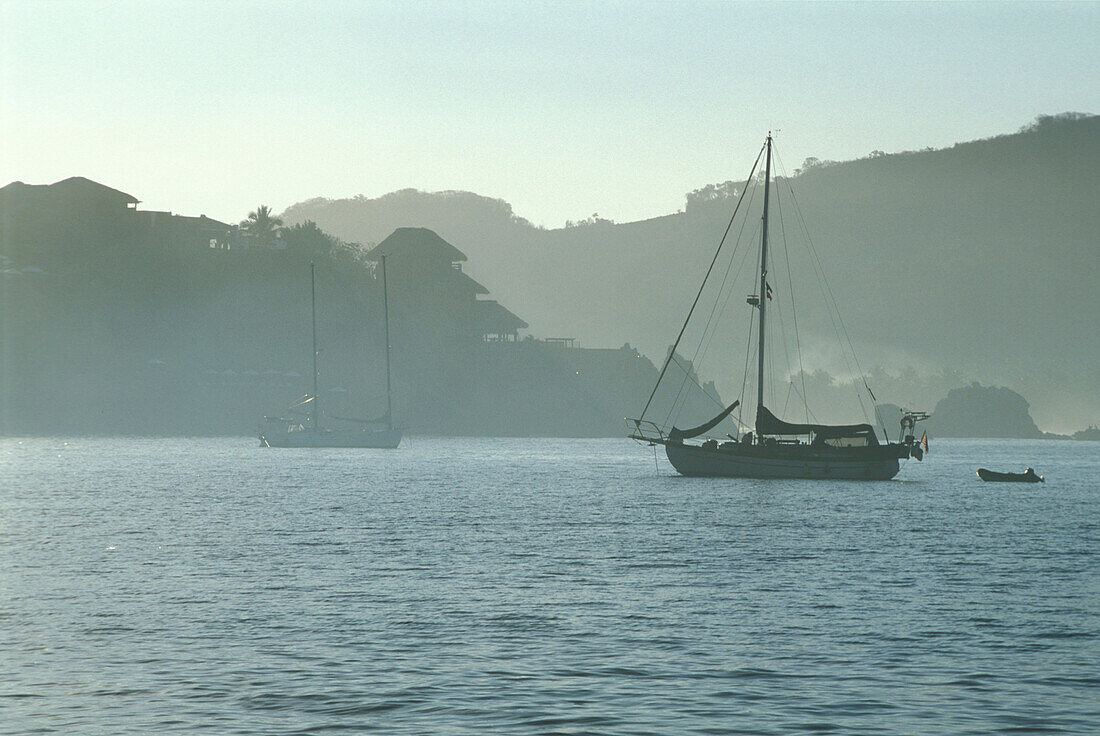 Sailing boats off shore, Bahia de Zihuatanejo, Guerreo, Mexico, America