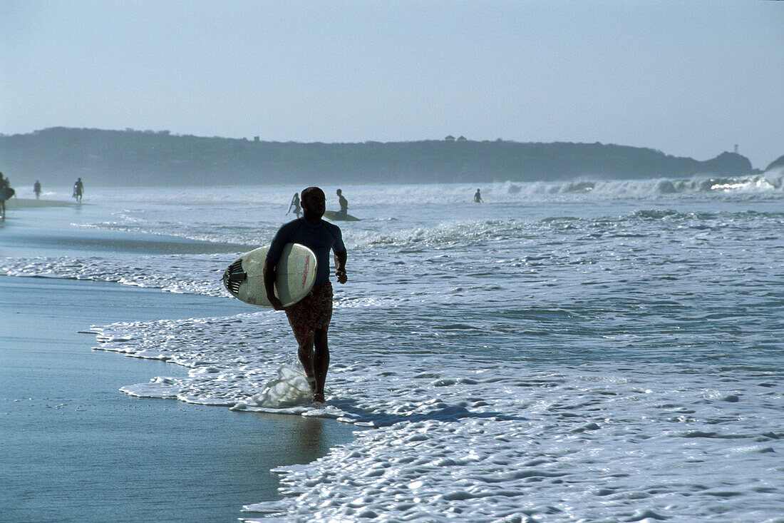 Surfer on the beach at Puerto Escondido, Oaxaca, Mexico, America