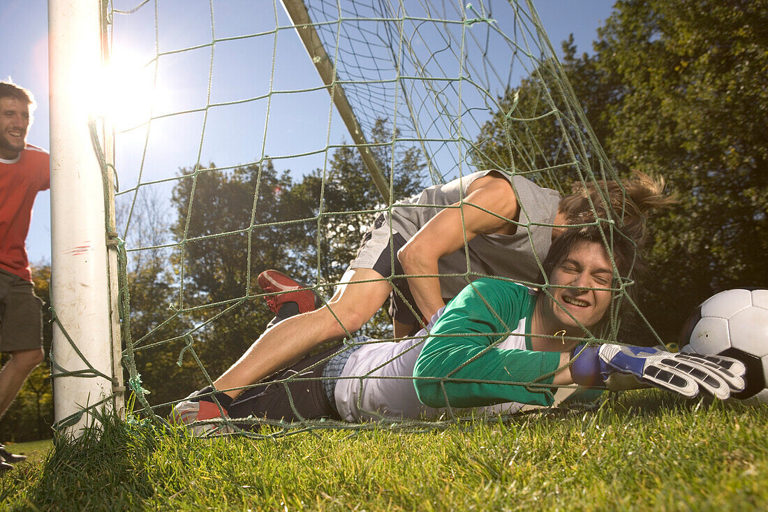 Young men playing soccer