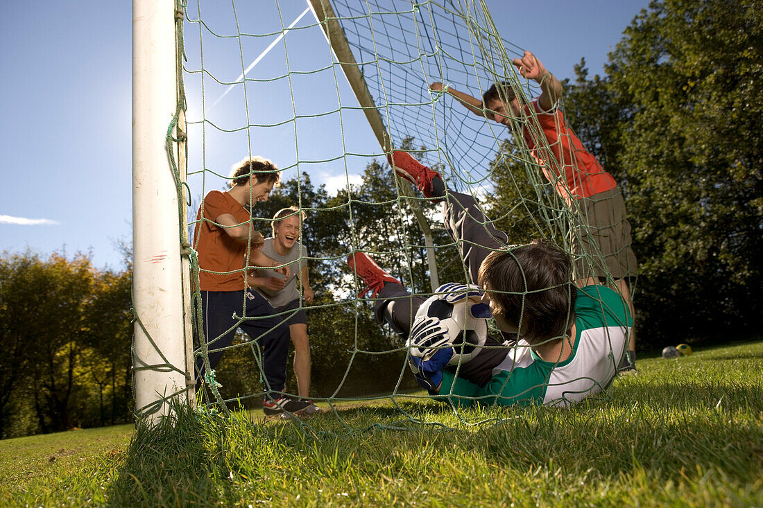 Young men playing soccer