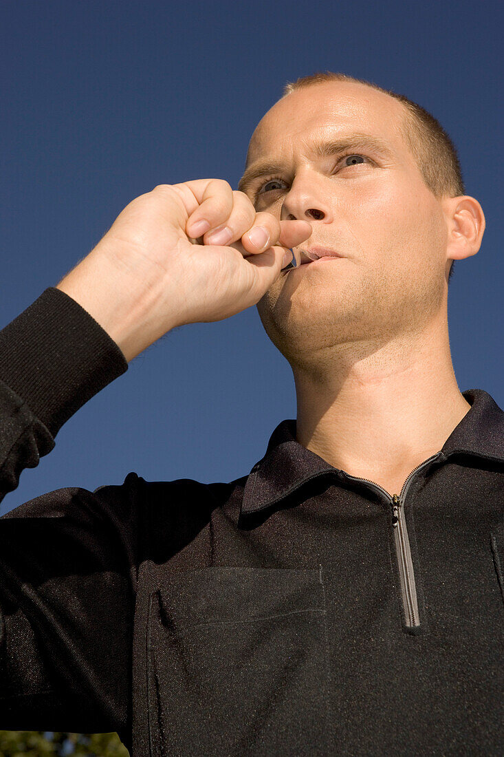 Referee blowing the whistle