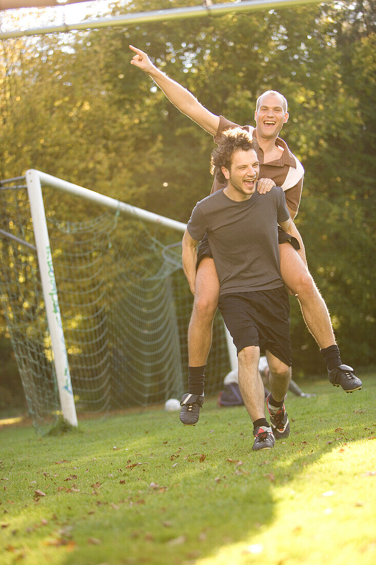 Young male soccer players jubilating