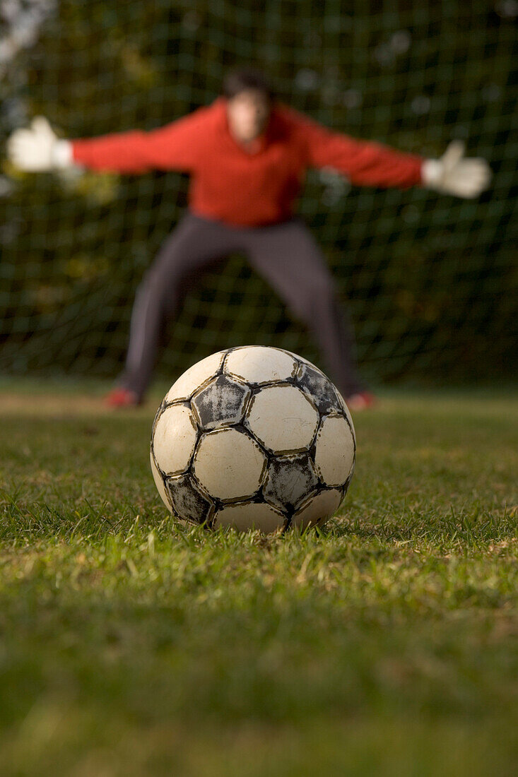 Young goalkeeper awaiting penalty