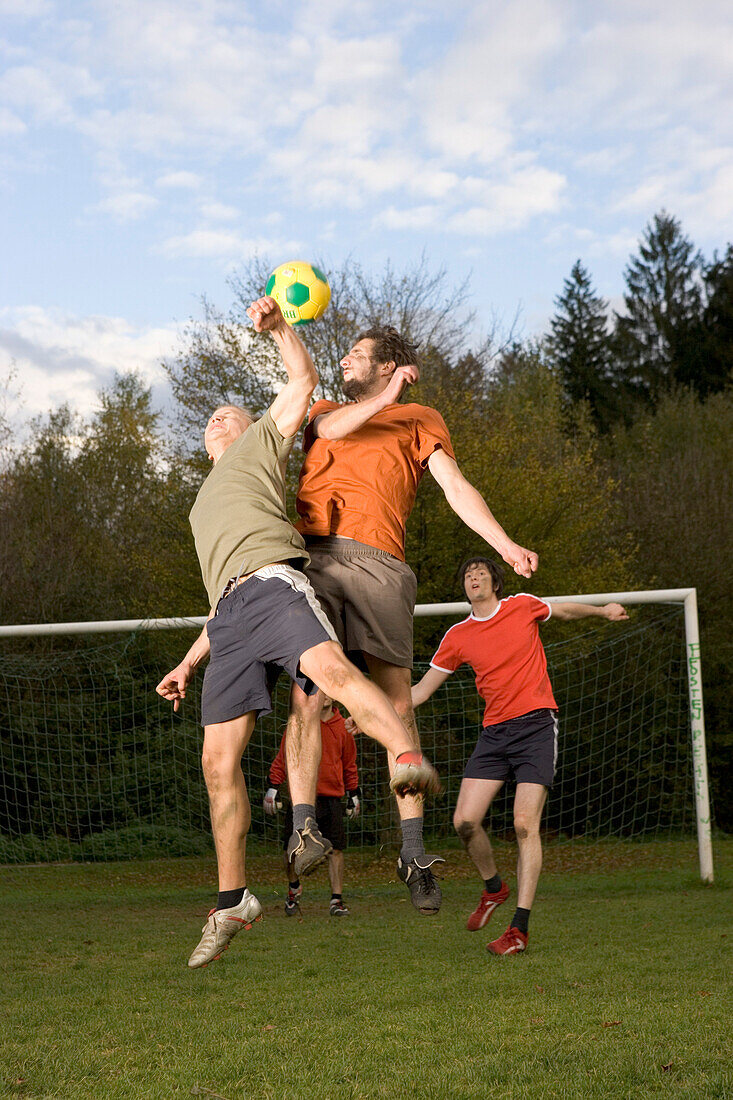 Young men playing soccer