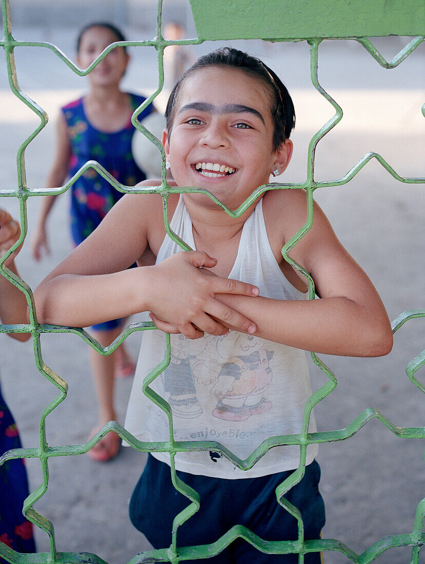 Children behind fence, Silk Road Uzbekistan