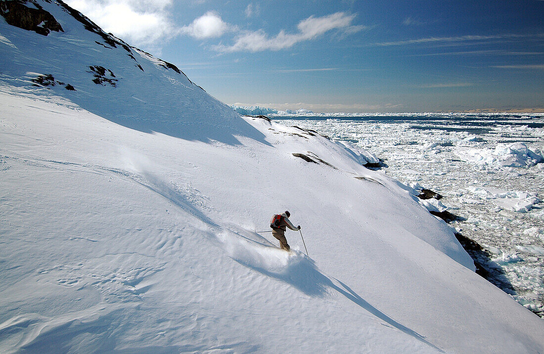 Person skiing down a slope, Ilulissat, Greenland