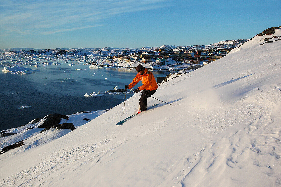 Person skiing down a slope, Ilulissat, Greenland
